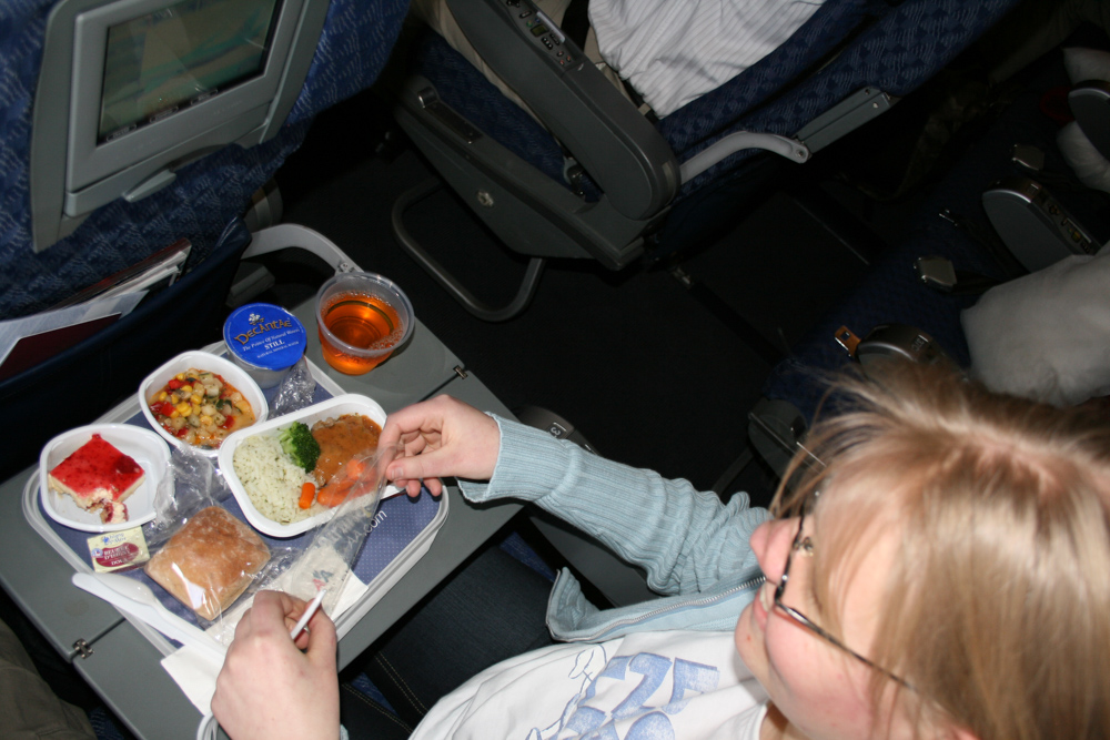 Henrieke enjoying some airplane food.