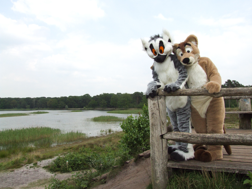 Tyler and Kiki posing together on a wooden observation platform