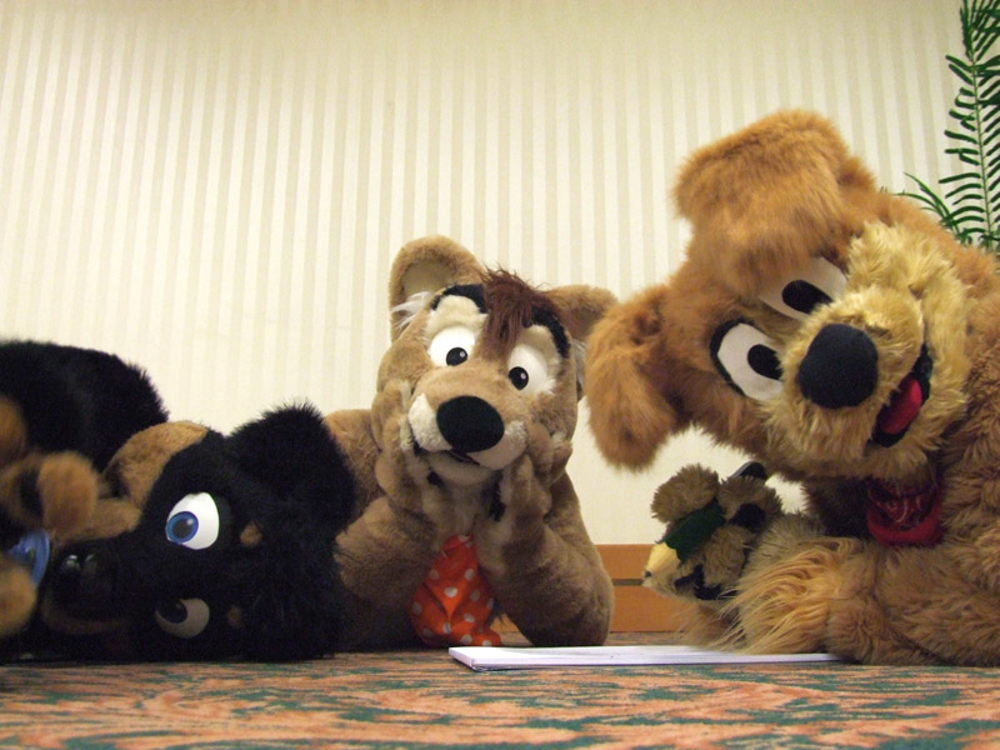 Sonny, Tyler and JD Puppy drawing together on the floor of the Artist Lounge