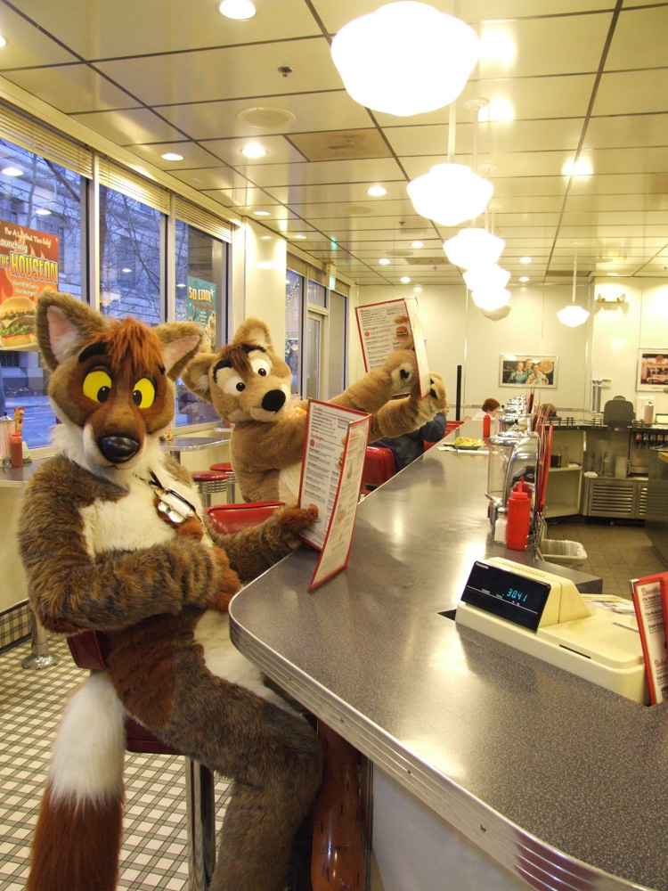 Tyler and Ciro sitting at the bar at a Johnny Rocket's.