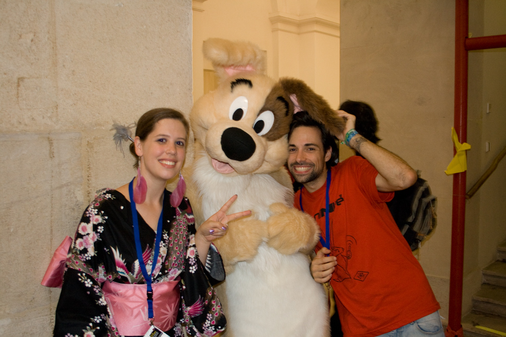Dog, posing for a photo with convention attendees