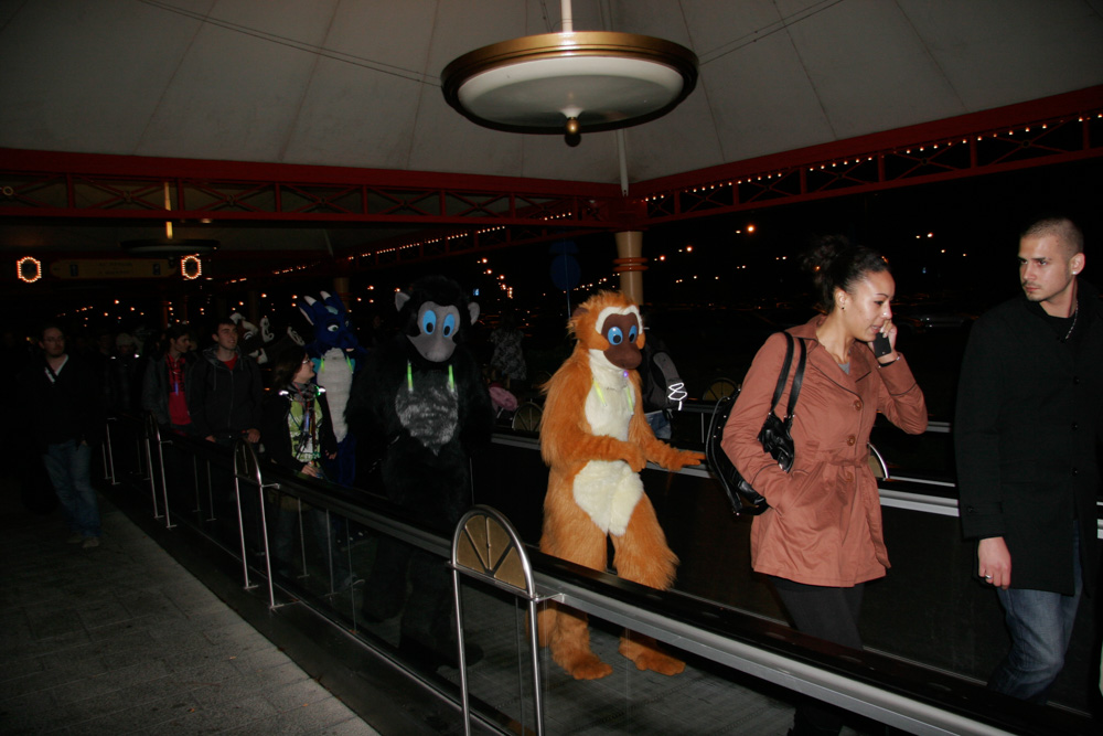 Lindy and Hop on the conveyor belt that goes towards the Disneyland entrance
