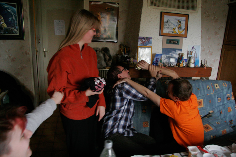 Henrieke and Luri being amused by Titash fighting with me over a jar of Nutella.