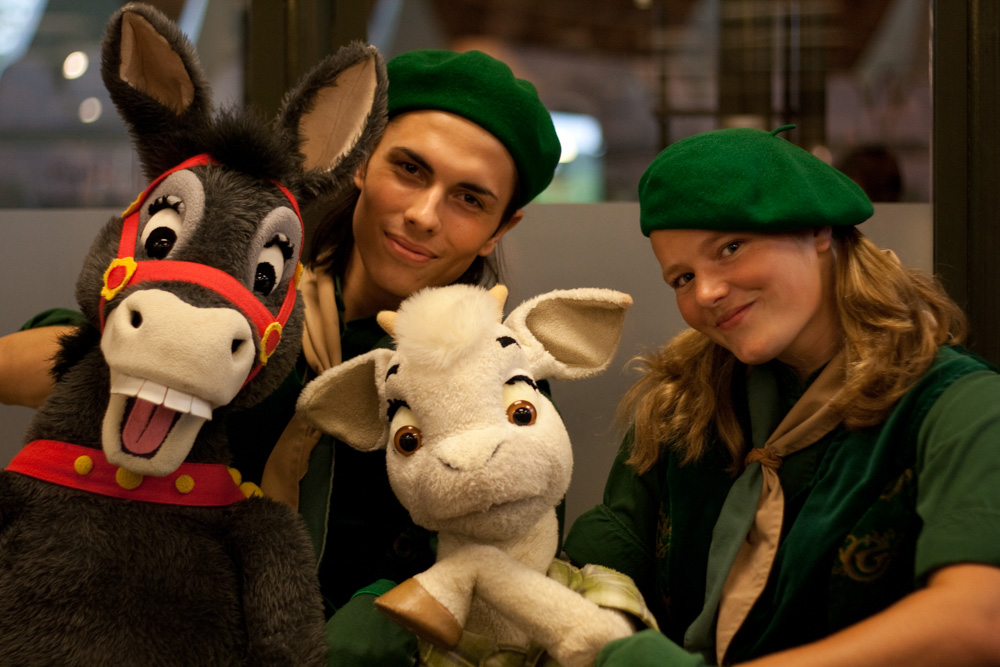 2 puppeteers and their puppets.