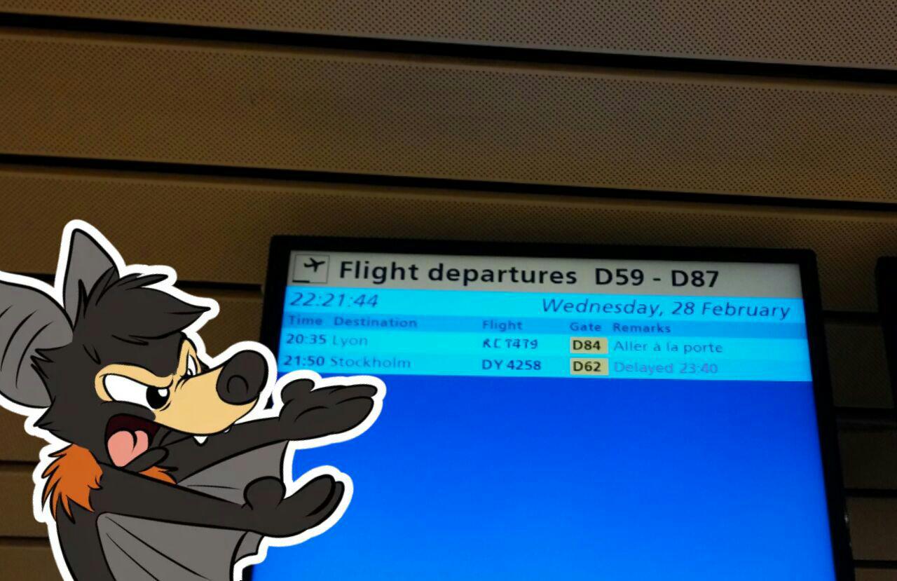 A sign at Schiphol airport showing our flight being delayed